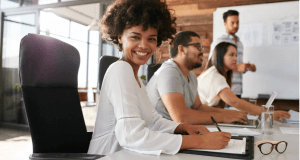 woman smiles at a business meeting